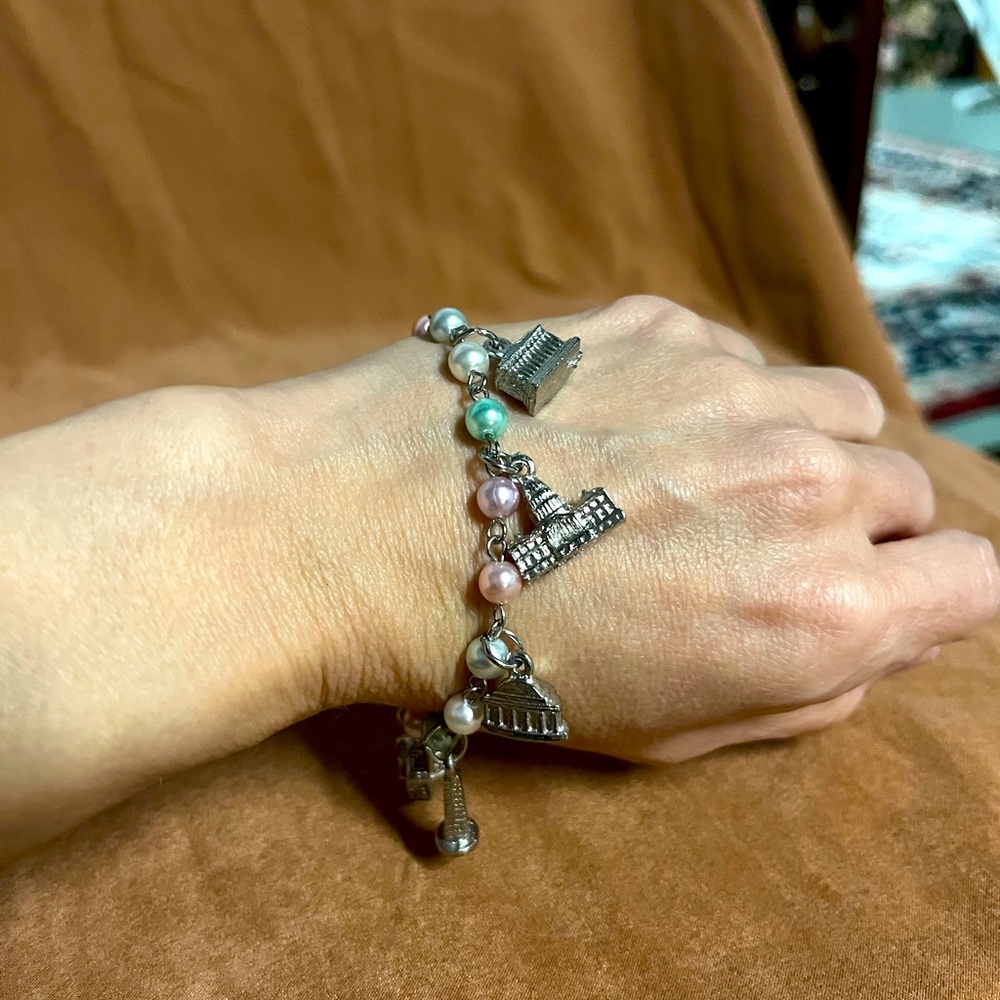 Beautiful silver tone charm bracelet. unique charms of historic buildings